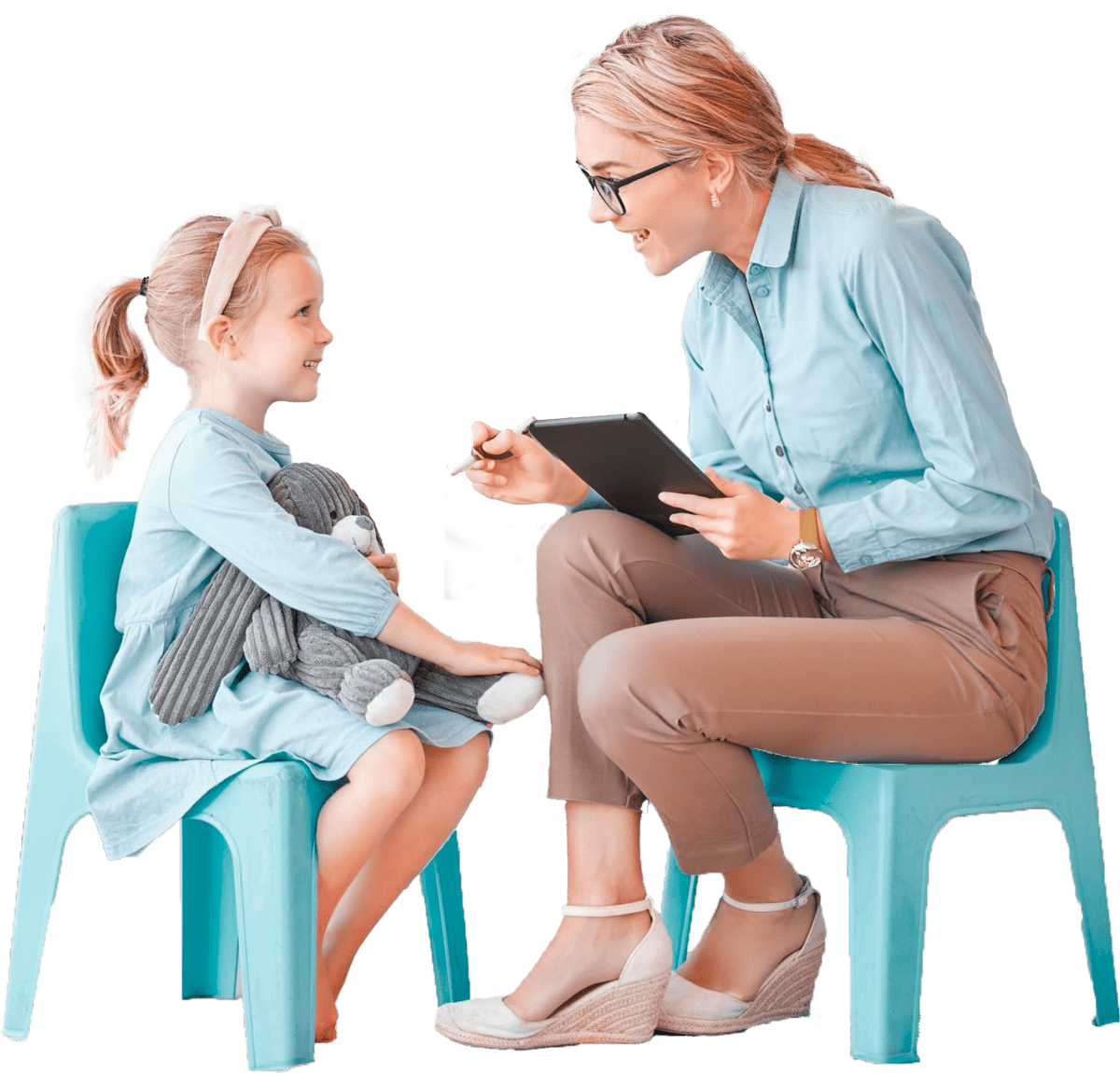 Clinician holding an ipad, sitting with young female caucasian client